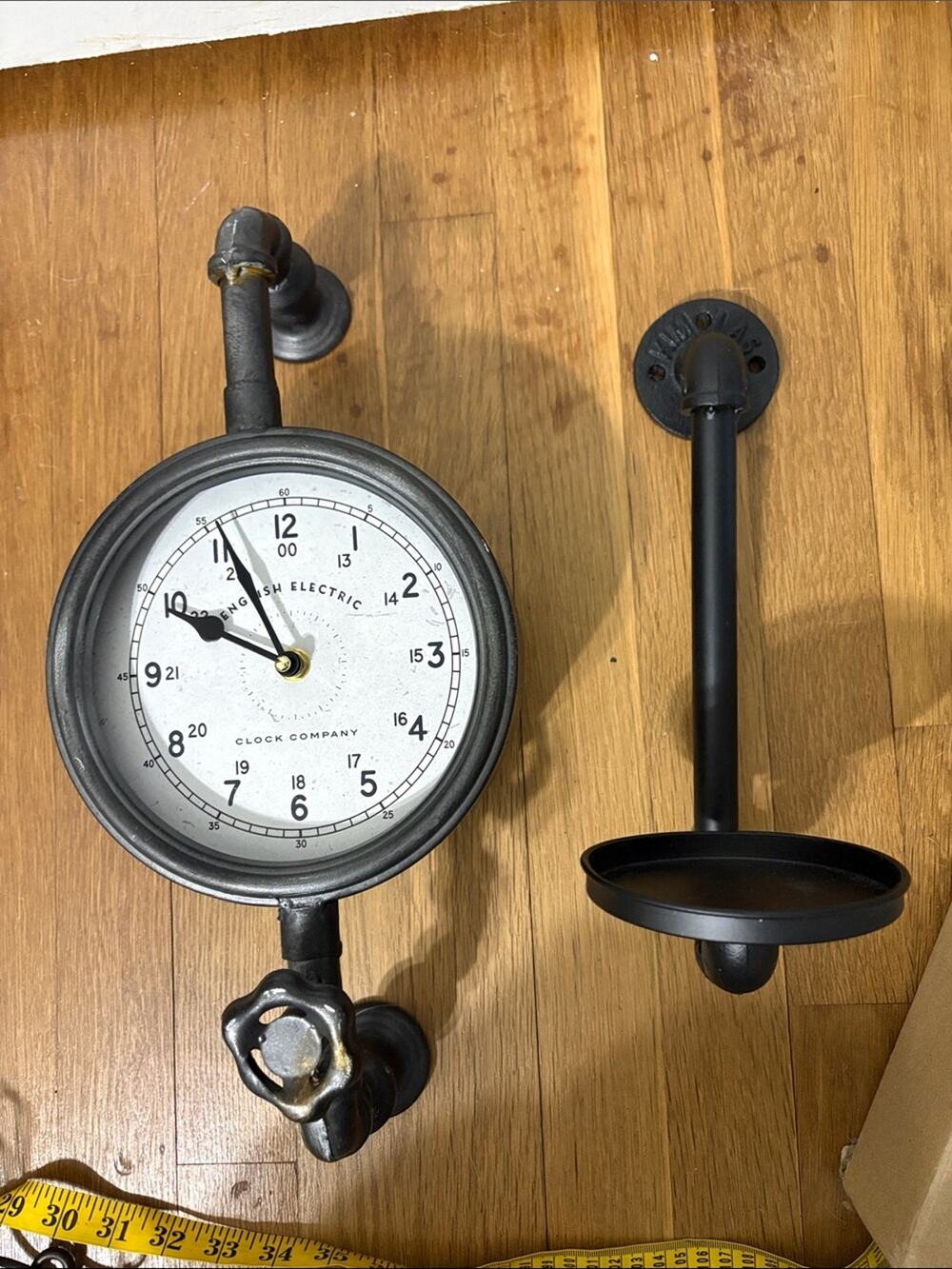 Steampunk pipe clock and candle platform